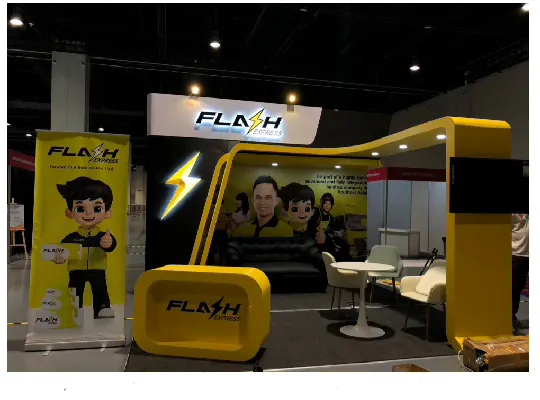 Exhibit booth with arch structure and branded counter fabricated for a national logistics company