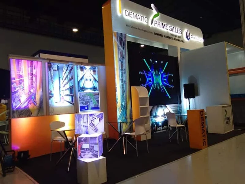 Expo trade show booth with branded display panels and lighting