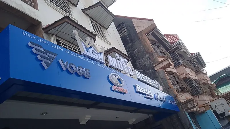 Blue illuminated fascia signage with build-up letters for a motorcycle dealership