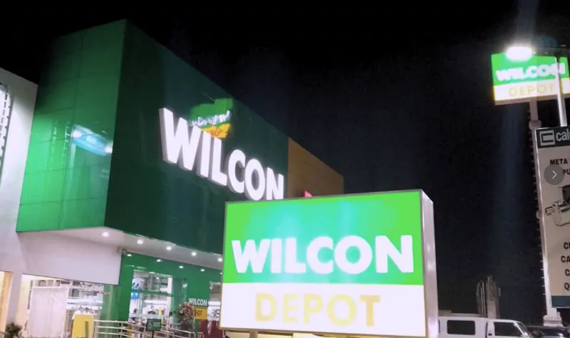 Illuminated storefront facade with build-up letters at night